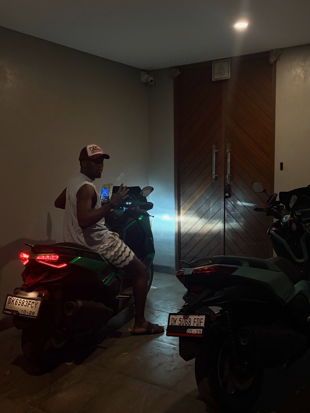 Zion Fajemilugba beside scooters during a 2026 trip to Bali